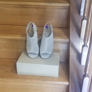 A pair of block heel sandal